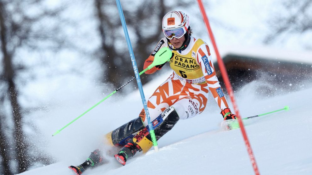 Slovakia's Petra Vlhova speeds down the course during the first run of an alpine ski, women's World Cup slalom, in Sestriere, Italy, Sunday, Dec.11, 2022. (AP Photo/Gabriele Facciotti)
