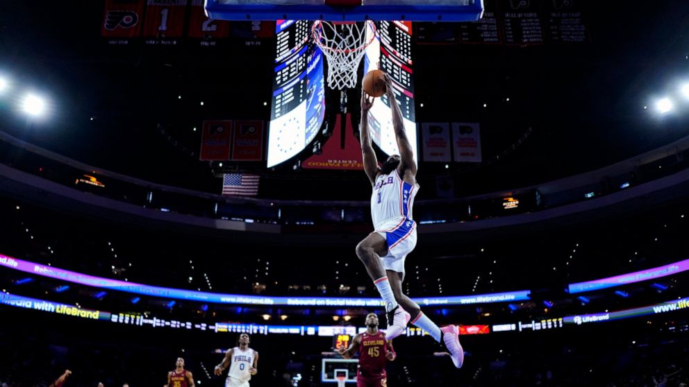 Philadelphia 76ers' James Harden goes up for a dunk during the first half of a preseason NBA basketball game against the Cleveland Cavaliers, Wednesday, Oct. 5, 2022, in Philadelphia. (AP Photo/Matt Slocum)