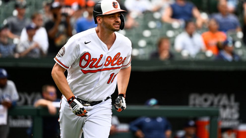 Baltimore Orioles designated hitter Trey Mancini watches his inside the park home run hit against Tampa Bay Rays relief pitcher Shawn Armstrong during the eighth inning of a baseball game, Thursday, July 28, 2022, in Baltimore. (AP Photo/Terrance Wil