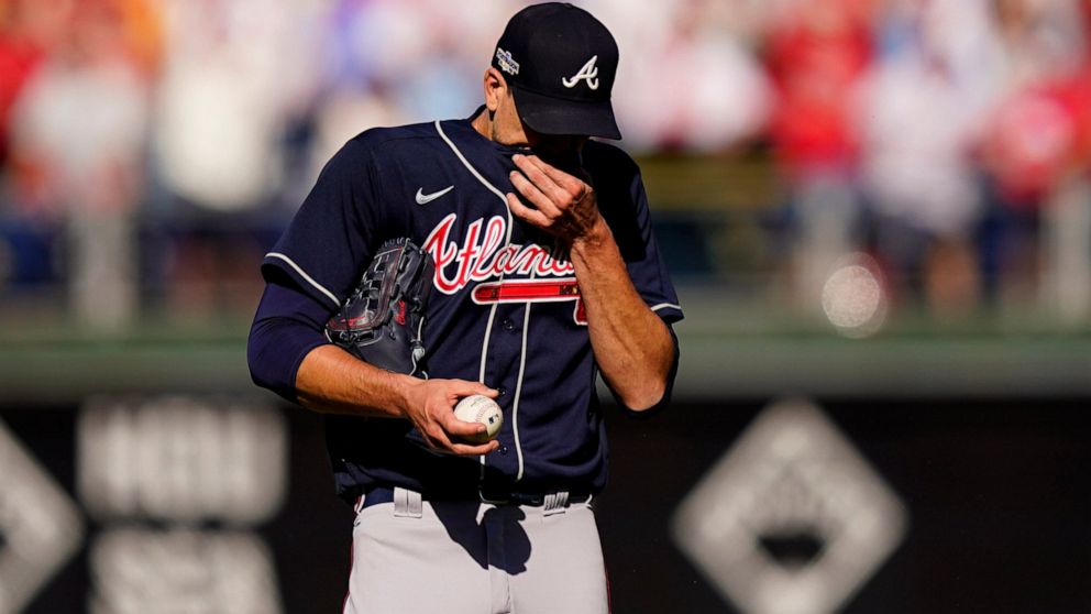 Atlanta Braves starting pitcher Charlie Morton (50) wipes his face during the second inning in Game 4 of baseball's National League Division Series between the Philadelphia Phillies and the Atlanta Braves, Saturday, Oct. 15, 2022, in Philadelphia. (A