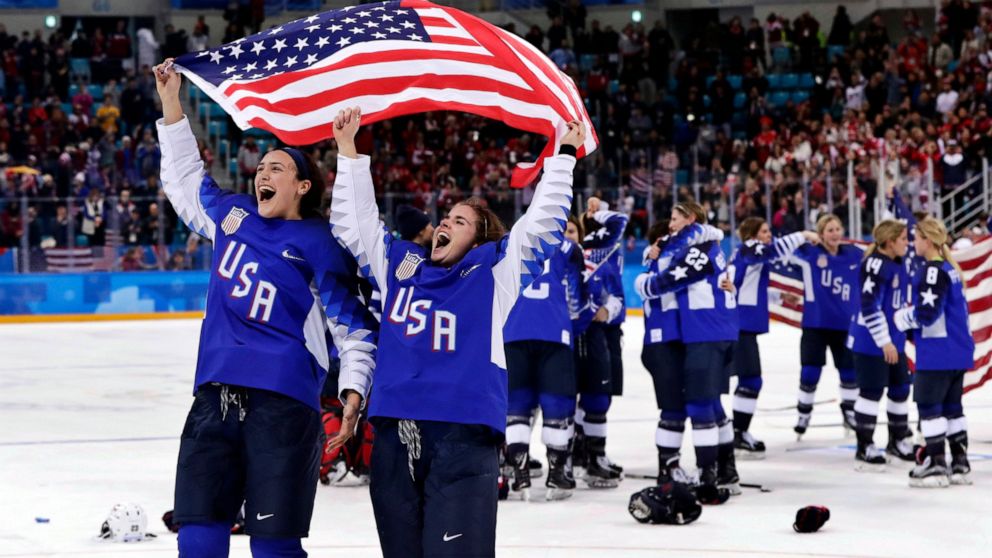 FILE - United States players celebrate after winning the women's gold medal hockey game against Canada at the 2018 Winter Olympics in Gangneung, South Korea, Feb. 22, 2018. The United States is the defending Olympic champion after beating Canada in a