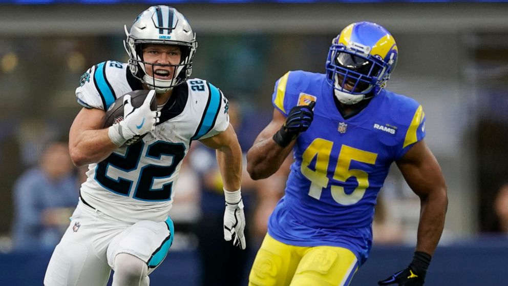 Carolina Panthers running back Christian McCaffrey (22) runs past Los Angeles Rams linebacker Bobby Wagner (45) during the second half of an NFL football game Sunday, Oct. 16, 2022, in Inglewood, Calif. (AP Photo/Ashley Landis)