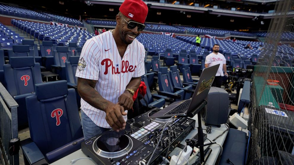 Everett DJ Hollywood plays music before Game 3 of baseball's World Series between the Houston Astros and the Philadelphia Phillies on Tuesday, Nov. 1, 2022, in Philadelphia. (AP Photo/David J. Phillip)