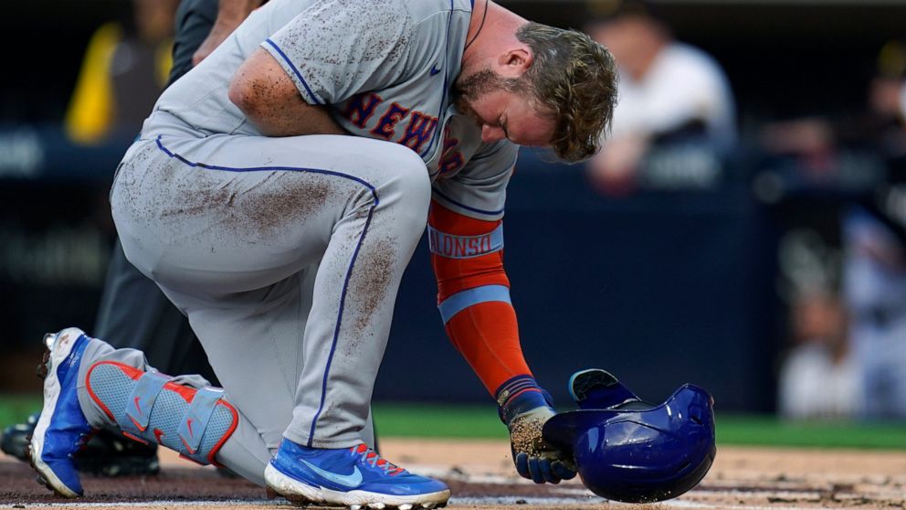 New York Mets' Pete Alonso reacts after being hit by a pitch while batting during the second inning of the team's baseball game against the San Diego Padres on Tuesday, June 7, 2022, in San Diego. (AP Photo/Gregory Bull)