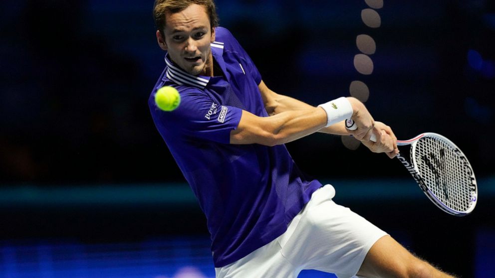 Danil Medvedev of Russia returns the ball to Hubert Hurkaz of Poland during their ATP World Tour Finals singles tennis match, at the Pala Alpitour in Turin, Sunday, Nov. 14, 2021. (AP Photo/Luca Bruno)