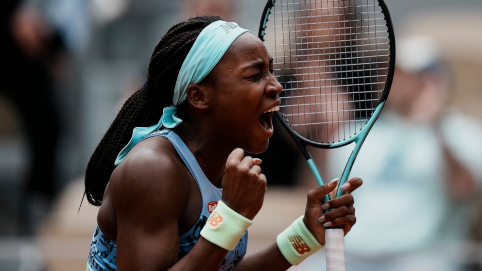Coco Gauff of the U.S. celebrates winning against Belgium's Elise Mertens in two sets, 6-4, 6-0, during their fourth round match at the French Open tennis tournament in Roland Garros stadium in Paris, France, Sunday, May 29, 2022. (AP Photo/Thibault 