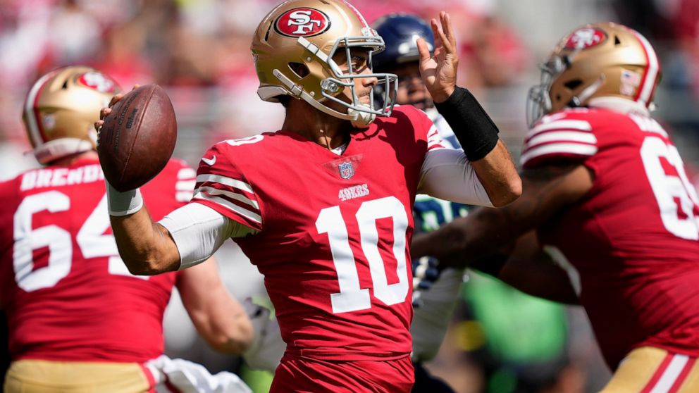 San Francisco 49ers quarterback Jimmy Garoppolo (10) passes against the Seattle Seahawks during the first half of an NFL football game in Santa Clara, Calif., Sunday, Sept. 18, 2022. (AP Photo/Tony Avelar)