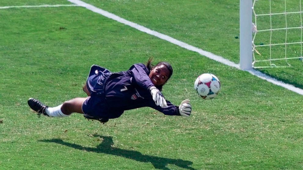 FILE - United States' goal keeper Briana Scurry (1) blocks a penalty shootout kick by China's Ying Liu during overtime of the Women's World Cup Final at the Rose Bowl in Pasadena, Calif., July 10, 1999. Scurry, 50, has a World Cup title, two Olympic 