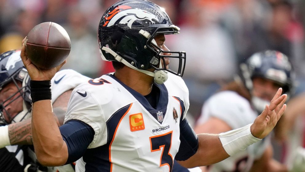 Denver Broncos quarterback Russell Wilson (3) throws the ball during the NFL football game between Denver Broncos and Jacksonville Jaguars at Wembley Stadium London, Sunday, Oct. 30, 2022. (AP Photo/Kirsty Wigglesworth)