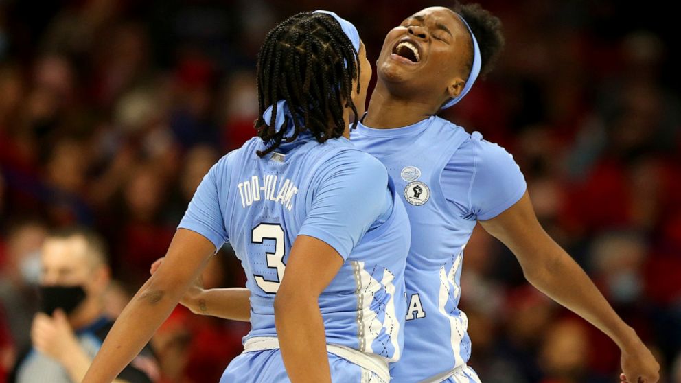 North Carolina guard Kennedy Todd-Williams (3) and forward Anya Poole, right, celebrate during a women's college basketball game in the NCAA tournament hosted in Tucson, Ariz., Monday, March 21, 2022. (Rebecca Sasnett/Arizona Daily Star via AP)