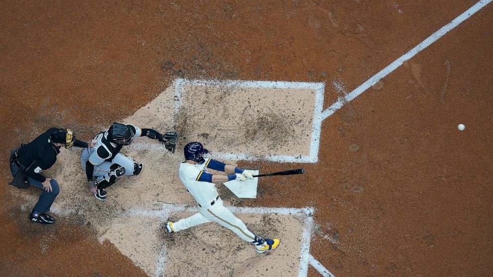 Milwaukee Brewers' Christian Yelich hits a grand slam during the fourth inning of a baseball game against the Pittsburgh Pirates Monday, April 18, 2022, in Milwaukee. (AP Photo/Morry Gash)