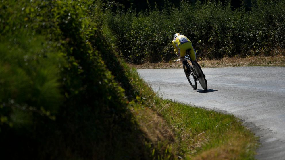 Denmark's Jonas Vingegaard, wearing the overall leader's yellow jersey, competes during the twentieth stage of the Tour de France cycling race, an individual time trial over 40.7 kilometers (25.3 miles) with start in Lacapelle-Marival and finish in R