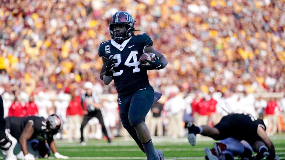 Minnesota running back Mohamed Ibrahim (24) runs for a touchdown during the first half of an NCAA college football game against Rutgers, Saturday, Oct. 29, 2022, in Minneapolis. (AP Photo/Abbie Parr)