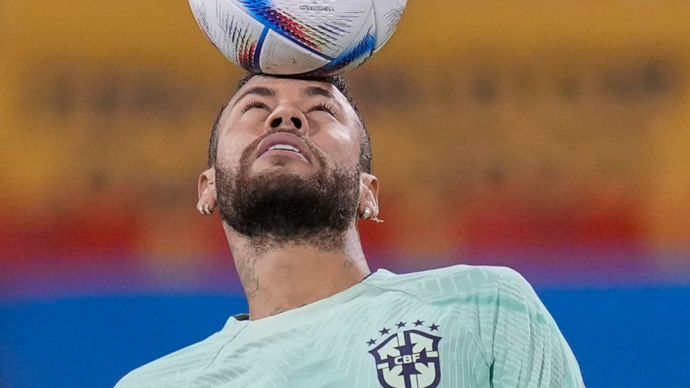 Brazil's Neymar practices during a training session at the Grand Hamad stadium in Doha, Qatar, Sunday, Dec. 4, 2022. Brazil will face South Korea in a World Cup round of 16 soccer match on Dec. 5. (AP Photo/Andre Penner)