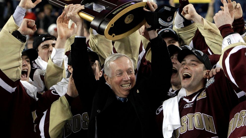 FILE — Boston College head coach Jerry York, center, holds up the championship trophy while celebrating their 5-0 victory over Wisconsin in the NCAA Frozen Four championship hockey game in Detroit, Saturday, April 10, 2010. York, 76, the Hockey Hall 