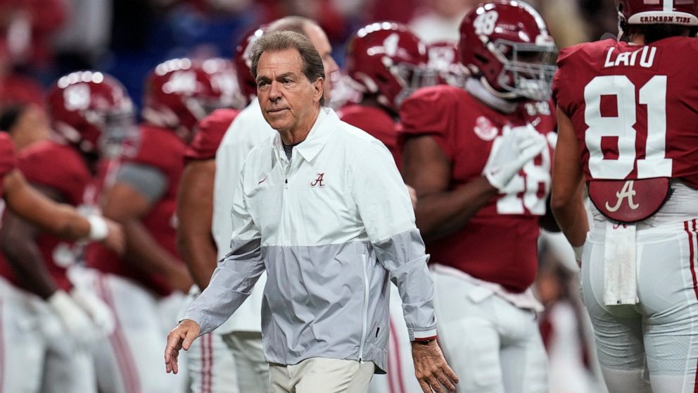 FILE - Alabama coach Nick Saban watches players warm up for the College Football Playoff championship NCAA football game against Georgia on Jan. 10, 2022, in Indianapolis. Saban is concerned about the current state of college football. He recently to