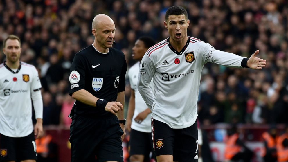 Manchester United's Cristiano Ronaldo gestures to Referee Anthony Taylor during the English Premier League soccer match between Aston Villa and Manchester United at Villa Park in Birmingham, England, Sunday, Nov. 6, 2022. (AP Photo/Rui Vieira)