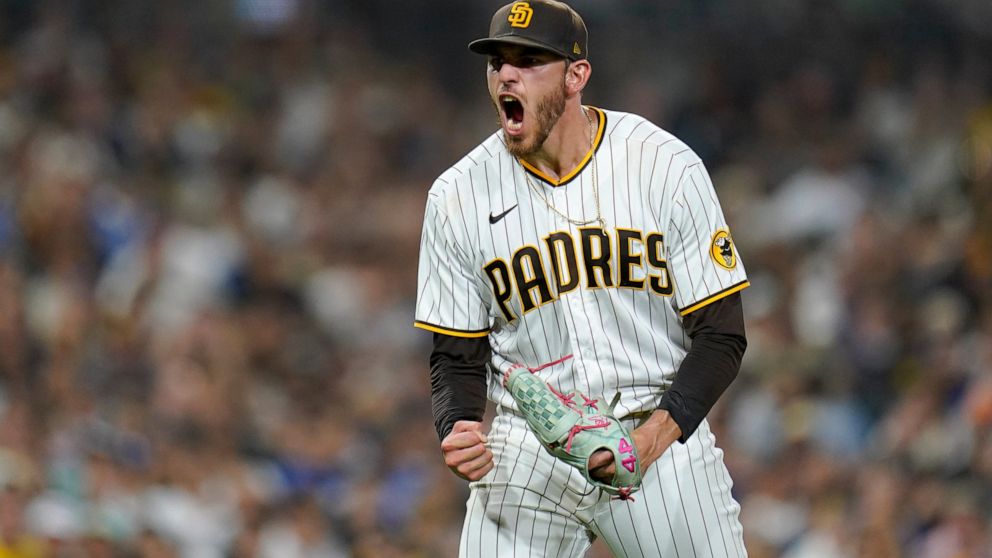 San Diego Padres starting pitcher Joe Musgrove reacts after getting the third out with the bases loaded during the fifth inning of the team's baseball game against the Los Angeles Dodgers, Wednesday, Sept. 28, 2022, in San Diego. (AP Photo/Gregory Bull)