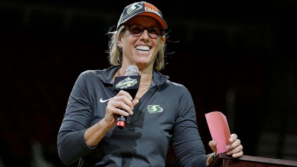 FILE - Seattle Storm owner Ginny Gilder speaks during a fan rally to celebrate the Storm winning the 2018 WNBA basketball championship, Sunday, Sept. 16, 2018, in Seattle. As Title IX marks its 50th anniversary this year, Gilder is one of countless w