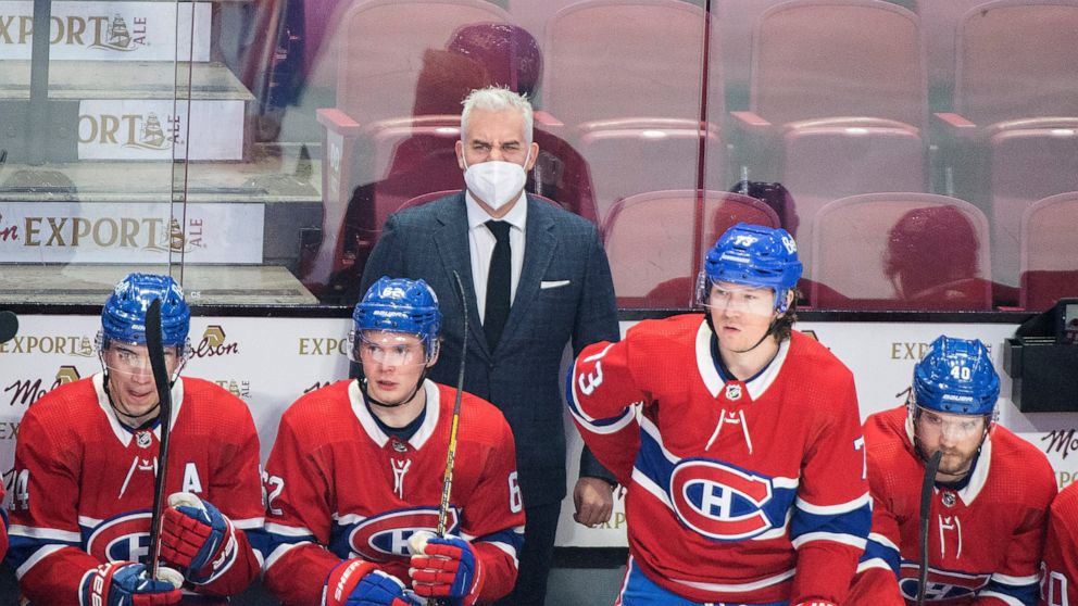Montreal Canadiens head coach Dominique Ducharme looks on from behind the bench during an NHL hockey game against the New Jersey Devils in Montreal, Tuesday, Feb. 8, 2022. The Montreal Canadiens have fired head coach Dominique Ducharme. The 48-year-o