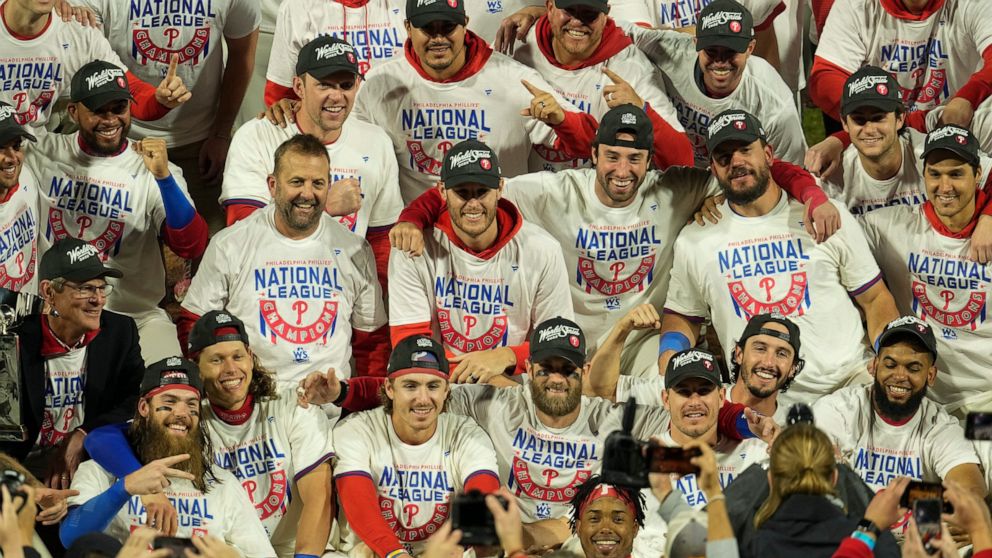 Philadelphia Phillies celebrate after winning the baseball NL Championship Series in Game 5 against the San Diego Padres on Sunday, Oct. 23, 2022, in Philadelphia. (AP Photo/Matt Rourke)