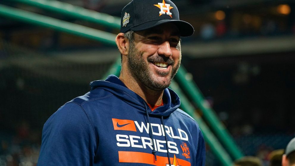Houston Astros starting pitcher Justin Verlander smiles before Game 3 of baseball's World Series between the Houston Astros and the Philadelphia Phillies on Tuesday, Nov. 1, 2022, in Philadelphia. (AP Photo/Chris Szagola)