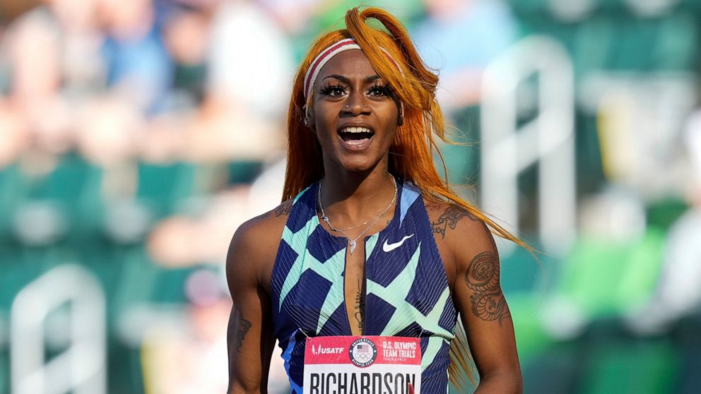 In this June 19, 2021 photo, Sha'Carri Richardson celebrates after winning the first heat of the semis finals in women's 100-meter runat the U.S. Olympic Track and Field Trials in Eugene, Ore. Richardson cannot run in the Olympic 100-meter race after