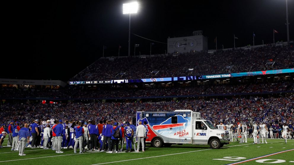 Players gather around an ambulance on the field after an injury to Buffalo Bills' Dane Jackson during the first half of an NFL football game against the Tennessee Titans, Monday, Sept. 19, 2022, in Orchard Park, N.Y. (AP Photo/Jeffrey T. Barnes)