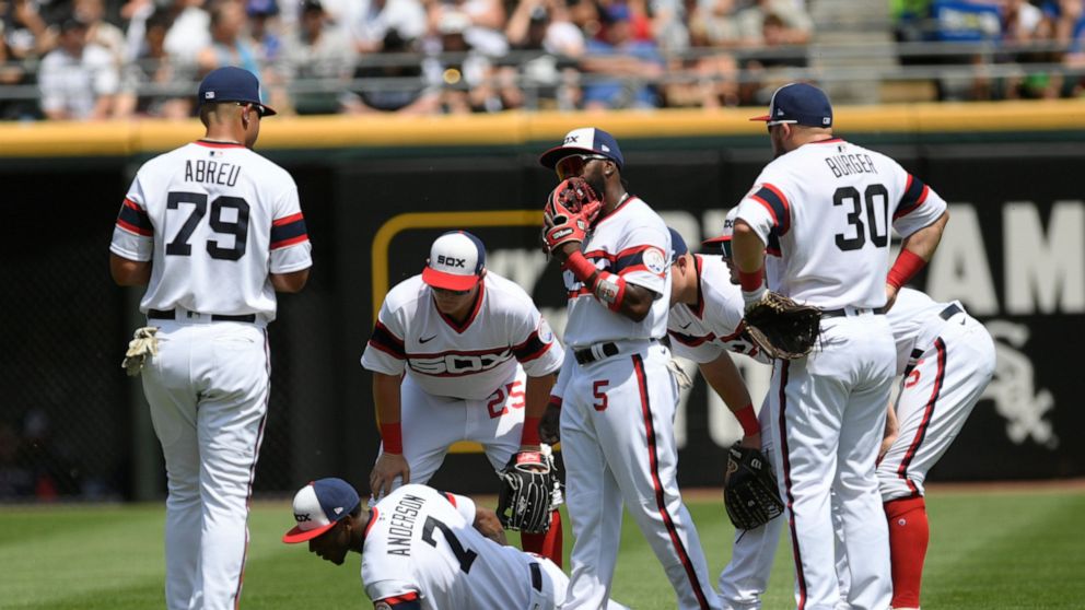 Chicago White Sox shortstop Tim Anderson lies on the field after being injured while throwing to first base during the fifth inning of a baseball game against the Chicago Cubs at Guaranteed Rate Field, Sunday, May 29, 2022, in Chicago. (AP Photo/Paul