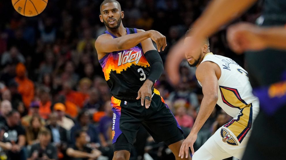Phoenix Suns guard Chris Paul (3) passes against the New Orleans Pelicans during the first half of Game 5 of an NBA basketball first-round playoff series, Tuesday, April 26, 2022, in Phoenix. (AP Photo/Matt York)