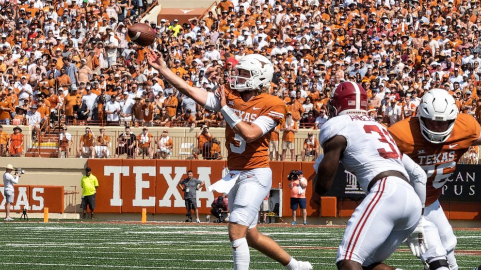 Texas quarterback Quinn Ewers throws a pass during the first half an NCAA college football game against Alabama, Saturday, Sept. 10, 2022, in Austin, Texas. (AP Photo/Michael Thomas)