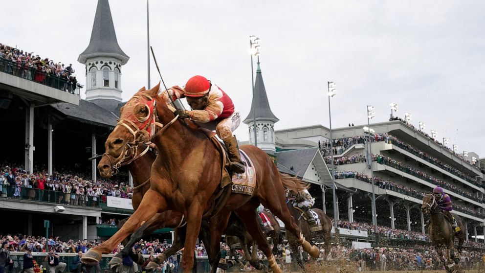 Rich Strike, with Sonny Leon aboard, crosses the finish line to win the 148th running of the Kentucky Derby horse race at Churchill Downs Saturday, May 7, 2022, in Louisville, Ky. (AP Photo/Jeff Roberson)