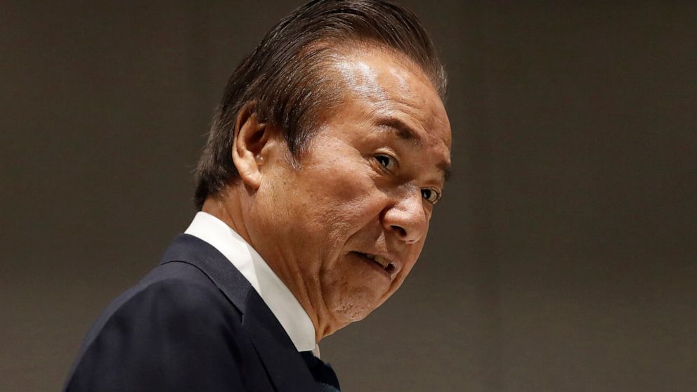 FILE - Haruyuki Takahashi, executive board member of the Tokyo Organizing Committee of the Olympic and Paralympic Games arrives at Tokyo 2020 Executive Board Meeting in Tokyo on March 30, 2020. Japanese prosecutors arrested Takahashi and three employ