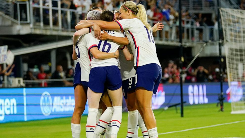 United States players celebrate a goal by Rose Lavelle, center, against Nigeria during the second half of an international friendly soccer match, Tuesday, Sept. 6, 2022, in Washington. (AP Photo/Julio Cortez)
