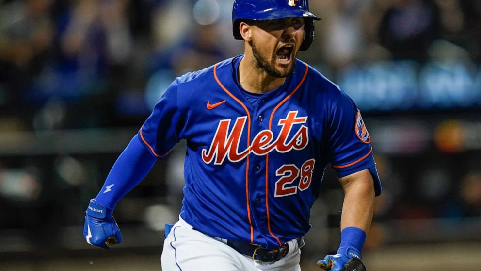 New York Mets' J.D. Davis celebrates after hitting a grand slam during the fifth inning of the team's baseball game against the Miami Marlins on Thursday, July 7, 2022, in New York. (AP Photo/Frank Franklin II)