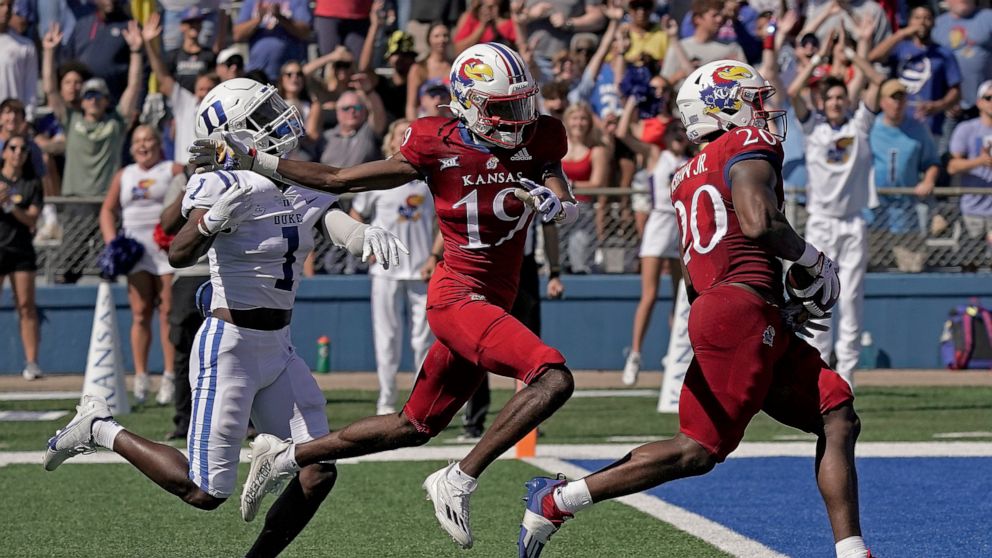 Kansas running back Daniel Hishaw Jr. (20) scores a touchdown during the first half of an NCAA college football game against Duke Saturday, Sept. 24, 2022, in Lawrence, Kan. (AP Photo/Charlie Riedel)