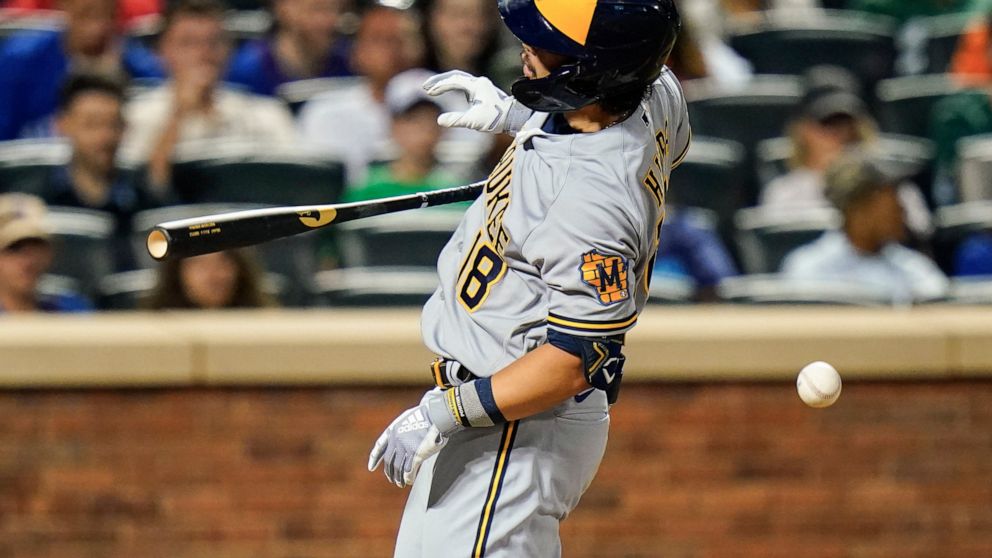 Milwaukee Brewers' Keston Hiura reacts after he is hit by a pitch during the fifth inning of a baseball game against the New York Mets, Wednesday, June 15, 2022, in New York. (AP Photo/Frank Franklin II)