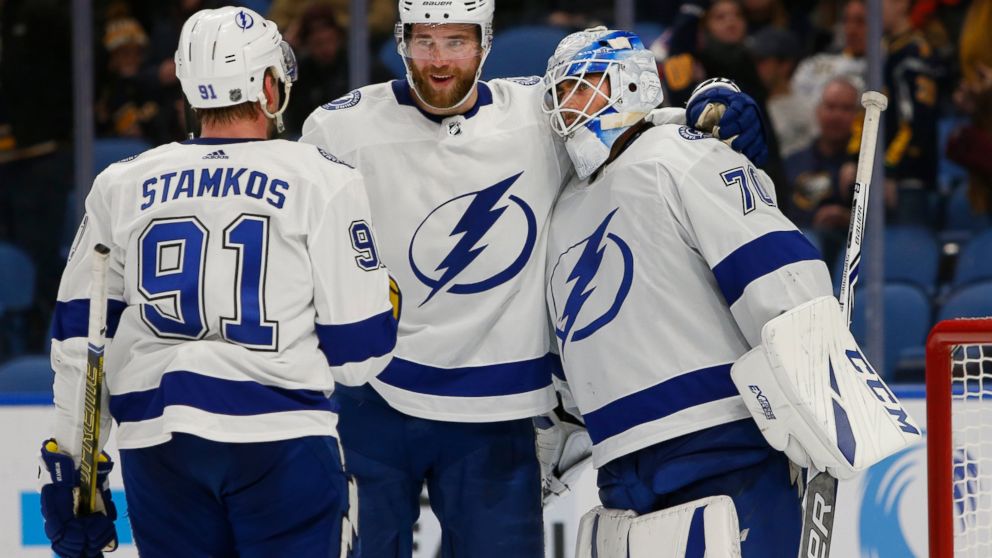 Tampa Bay Lightning's Steven Stamkos (91), Victor Hedman (77) and Louis Domingue (70) celebrate a victory over the Buffalo Sabres following the third period of an NHL hockey game, Saturday, Jan. 12, 2019, in Buffalo N.Y. (AP Photo/Jeffrey T. Barnes)