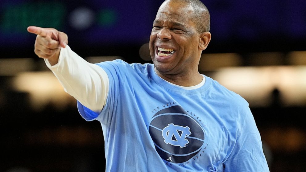 FILE - North Carolina head coach Hubert Davis points during practice at the men's Final Four NCAA college basketball tournament, on April 1, 2022, in New Orleans. National runner-up North Carolina, a strong contender for the No. 1 spot in the preseas