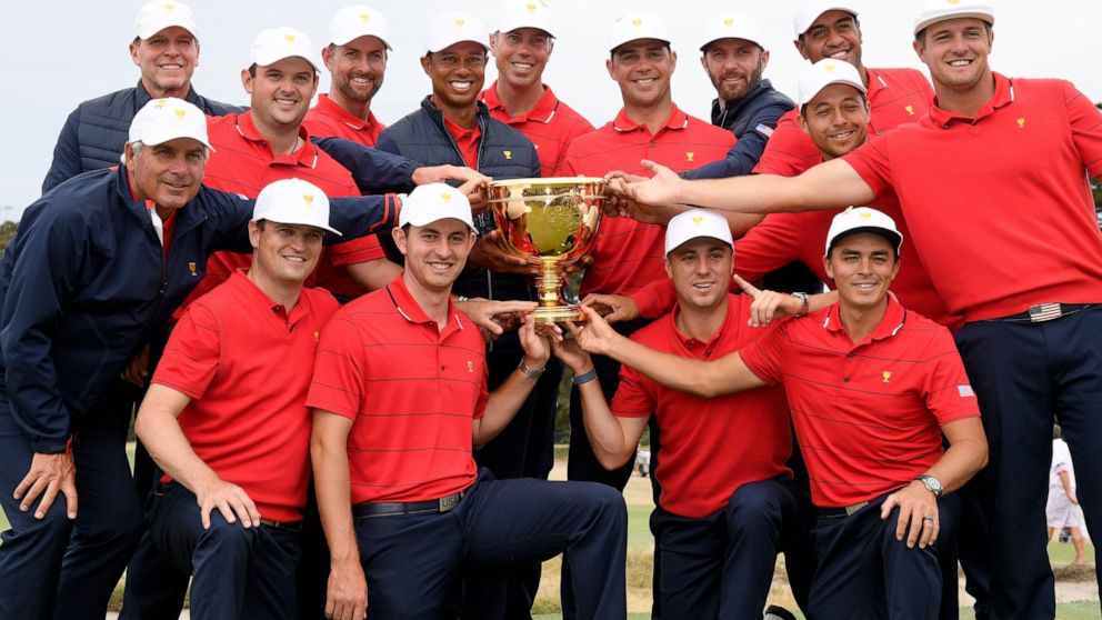 FILE - The U.S. team hold their trophy after they won the President's Cup golf tournament at Royal Melbourne Golf Club in Melbourne, Sunday, Dec. 15, 2019. The U.S. team won the tournament 16-14. The last Presidents Cup was so close the International