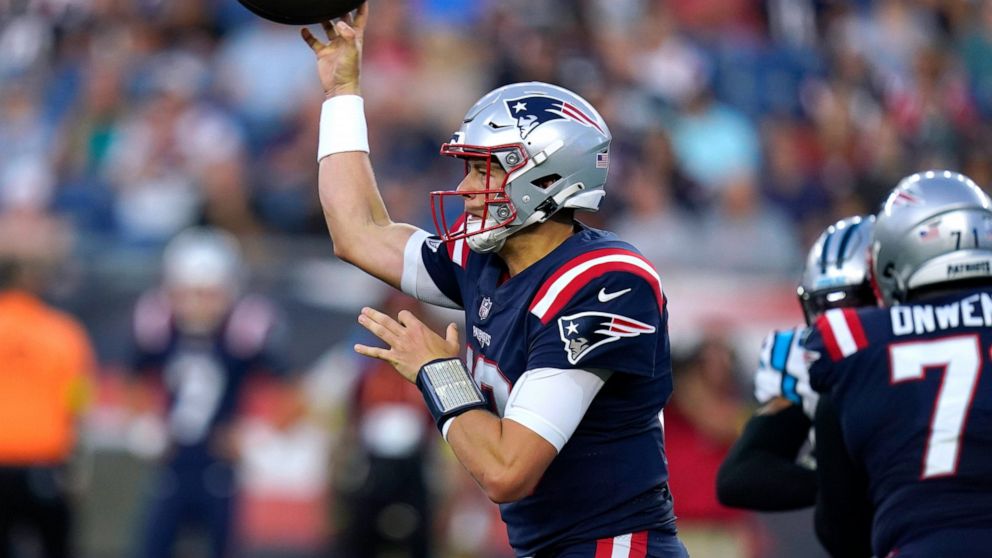 New England Patriots quarterback Mac Jones throws a pass against the Carolina Panthers during the first half of a preseason NFL football game Friday, Aug. 19, 2022, in Foxborough, Mass. (AP Photo/Michael Dwyer)