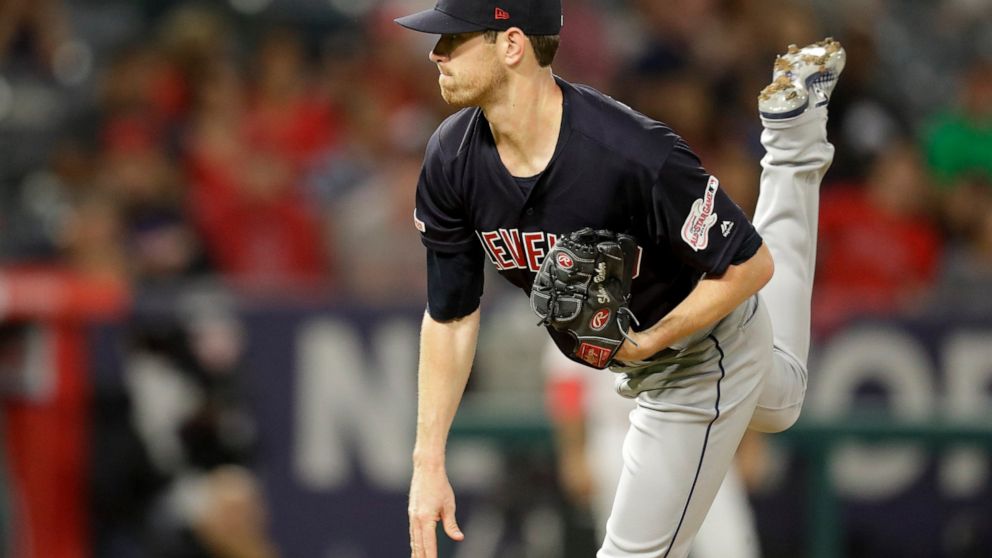 Cleveland Indians starting pitcher Shane Bieber throws against the Los Angeles Angels during the first inning of a baseball game in Anaheim, Calif., Monday, Sept. 9, 2019. (AP Photo/Chris Carlson)