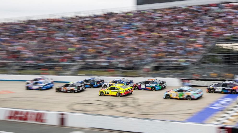 Ryan Blaney (12) races toward Turn 1 during a restart at the NASCAR Cup Series auto race at Dover Motor Speedway, Sunday, May 1, 2022, in Dover, Del. (AP Photo/Jason Minto)