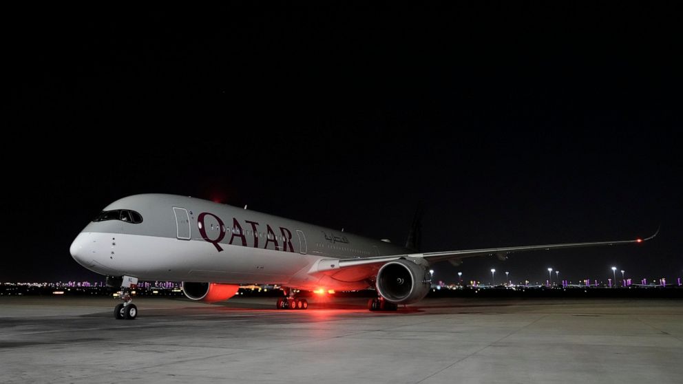 A Qatar Airways aircraft lands with members of the United States national soccer team at Hamad International airport in Doha, Qatar, Thursday, Nov. 10, 2022 ahead of the upcoming World Cup. The US will play their first match in the World Cup against 