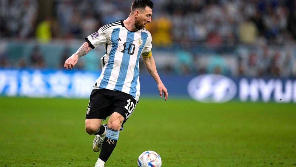 Argentina's Lionel Messi dribbles the ball during the World Cup round of 16 soccer match between Argentina and Australia at the Ahmad Bin Ali Stadium in Doha, Qatar, Saturday, Dec. 3, 2022. (AP Photo/Frank Augstein)