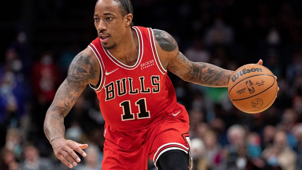 Chicago Bulls forward DeMar DeRozan drives to the basket against the Charlotte Hornets during the first half of an NBA basketball game in Charlotte, N.C., Wednesday, Feb. 9, 2022. (AP Photo/Jacob Kupferman)