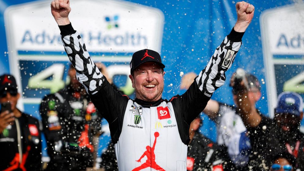 Kurt Busch celebrates in victory lane after winning a NASCAR Cup Series auto race at Kansas Speedway in Kansas City, Kan., Sunday, May 15, 2022. (AP Photo/Colin E. Braley)