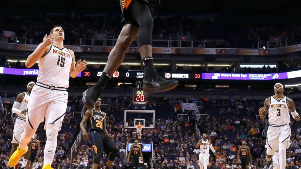 Phoenix Suns center Deandre Ayton (22) dunks against the Denver Nuggets in the second half during an NBA basketball game, Saturday, Jan. 12, 2019, in Phoenix. (AP Photo/Rick Scuteri)