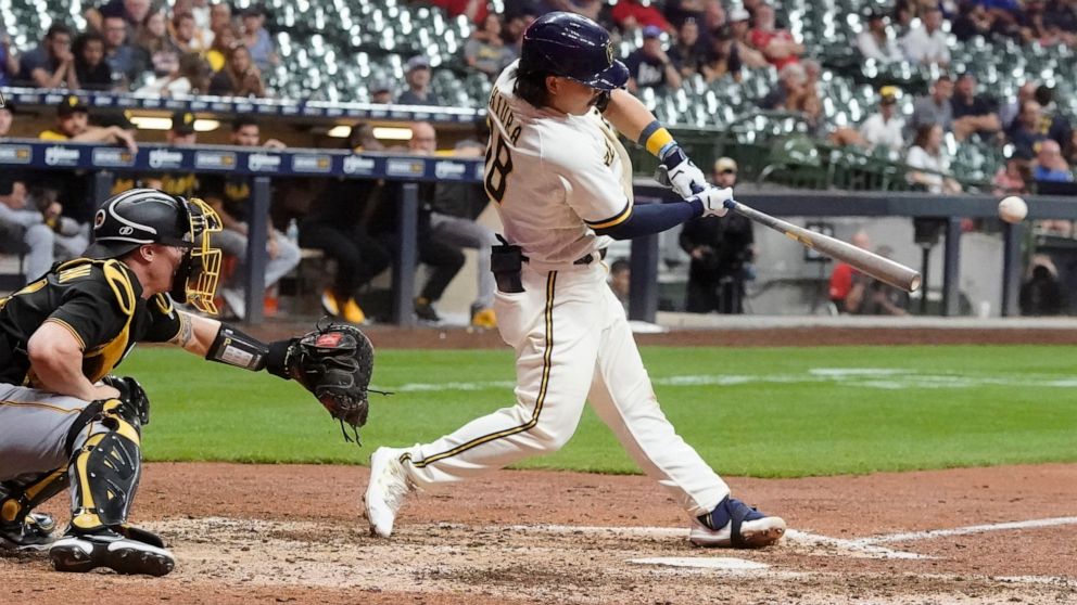 Milwaukee Brewers' Keston Hiura hits a walk off two-run home during the ninth inning of a baseball game against the Pittsburgh Pirates Monday, Aug. 29, 2022, in Milwaukee. (AP Photo/Morry Gash)