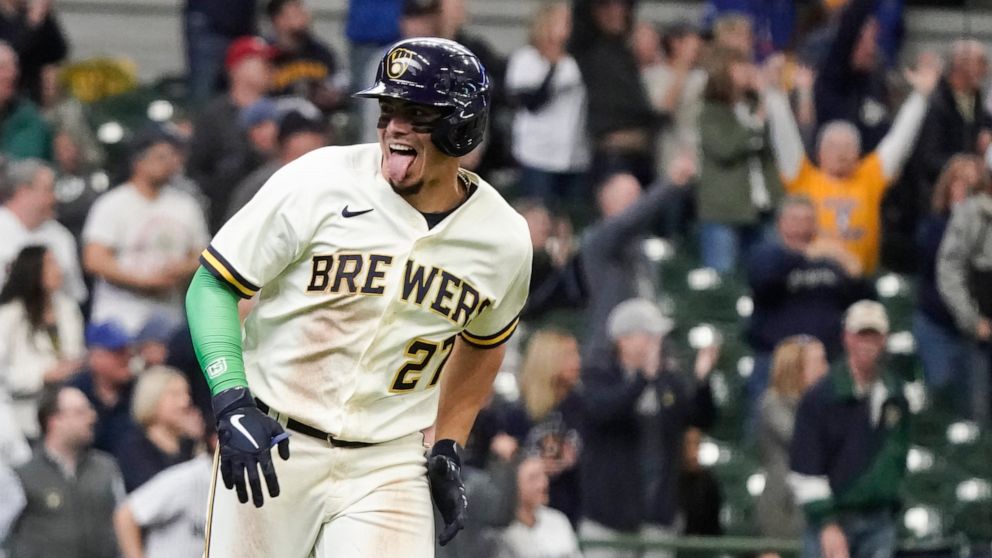 Milwaukee Brewers' Willy Adames celebrates after hitting a two-run home run during the eighth inning of a baseball game against the Cincinnati Reds Thursday, May 5, 2022, in Milwaukee. (AP Photo/Morry Gash)